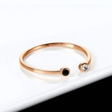 Bague manchette double en or rose avec pierres noires et transparentes