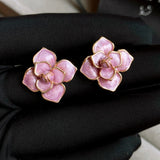 Boucles d'oreilles clous fleurs en émail violet et or