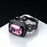 Bague avec pierre précieuse rose et anneau noir en or finement ouvragé