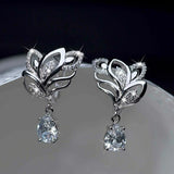 Boucles d'oreilles argentées à cristaux floraux scintillants