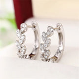 Boucles d'oreilles argentées en forme de feuilles scintillantes