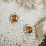 Boucles d'oreilles marron étincelantes en or