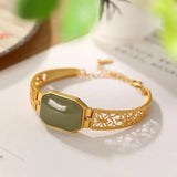 Bracelet vintage en or vert avec motif papillon creux