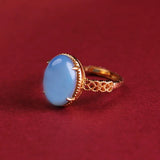 Bague ajustable vintage en or avec pierre précieuse ovale bleu clair
