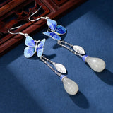 Boucles d'oreilles vintage en argent et bleu avec pompons papillon