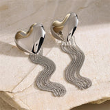 Boucles d'oreilles classiques en argent avec cœur et chaîne à pompons