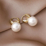 Boucles d'oreilles vintage en or avec perles rondes