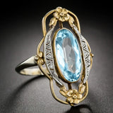 Bague bicolore en or et argent avec pierres précieuses bleues