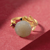 Bague ajustable vintage en or sculpté avec pierre verte et motif floral