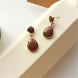 Boucles d'oreilles pendantes vintage en or brun