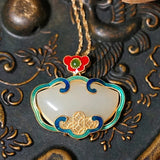 Collier pendentif floral rouge et vert avec nuage doré intemporel