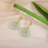 Boucles d'oreilles pendantes vintage en or et cristal vert