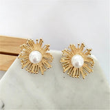 Boucles d'oreilles en or avec perles et motif soleil rayonnant