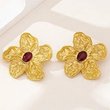 Boucles d'oreilles classiques en or avec fleur ovale et pierre rouge