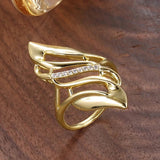 Bague vintage en or avec motif de feuilles entrelacées