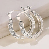 Boucles d'oreilles vintage en argent sculpté