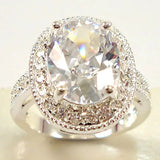 Bague vintage en argent avec pierre précieuse ovale et halo