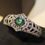 Bague vintage avec pierre verte et diamants
