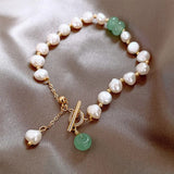 Bracelet vintage en perles et or avec pierres précieuses vertes