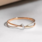 Bague croisée en argent et or rose