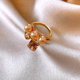 Bague ajustable vintage en or champagne et perles