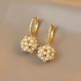 Boucles d'oreilles créoles en or avec perles