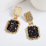 Boucles d'oreilles vintage en or noir scintillant