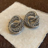 Boucles d'oreilles vintage en argent avec nœud torsadé