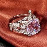 Bague en argent avec pierre précieuse violette, feuille et cristal