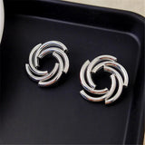 Boucles d'oreilles classiques en argent entrelacées en forme de spirale