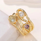 Bague triple pierres précieuses en or