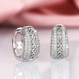 Boucles d'oreilles vintage argentées à motif tourbillon