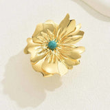 Bague ajustable en or avec fleur centrale et pierre précieuse turquoise