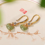 Boucles d'oreilles classiques en or et cristal vert jade en forme de goutte