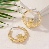 Boucles d'oreilles créoles ailées en forme de cœur en or