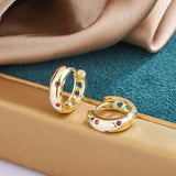 Boucles d'oreilles vintage en or avec pierres rouges
