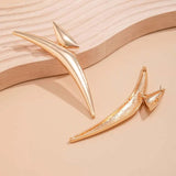 Boucles d'oreilles sculptées asymétriques vintage en or