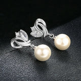 Boucles d'oreilles classiques en argent avec perles et style vintage