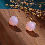 Boucles d'oreilles classiques en or rose avec opale et motif floral délicat