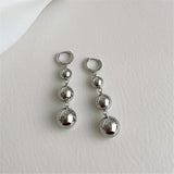 Boucles d'oreilles pendantes à trois boules en argent