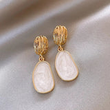 Boucles d'oreilles pendantes ovales vintage en or