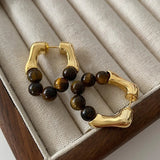 Boucles d'oreilles créoles vintage en or et perles œil-de-tigre