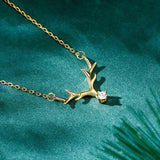 Collier vintage en or avec bois de cerf et cristal