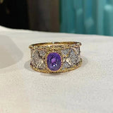 Bague florale en or et pierres précieuses violettes