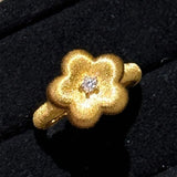 Bague vintage en or ajustable avec diamant central et motif floral