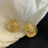 Boucles d'oreilles vintage à tige circulaire en spirale dorée