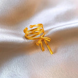 Bague ouverte vintage en or avec nœud en ruban