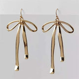 Boucles d'oreilles longues pendantes vintage en or avec nœud