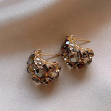 Boucles d'oreilles pendantes en cristal champagne doré étincelant