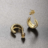 Boucles d'oreilles vintage en spirale dorées à la texture élégante